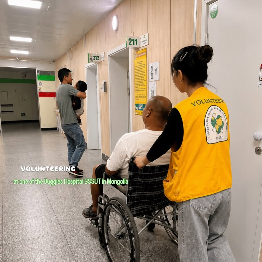 EEJII volunteer assisting a patient at a hospital visit